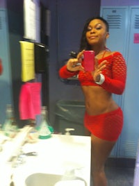 a woman is taking a selfie in a bathroom