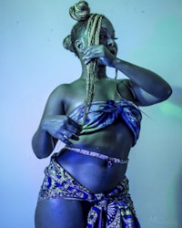 a woman in a blue outfit posing for a photo