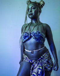 a woman in a blue bikini posing for a photo